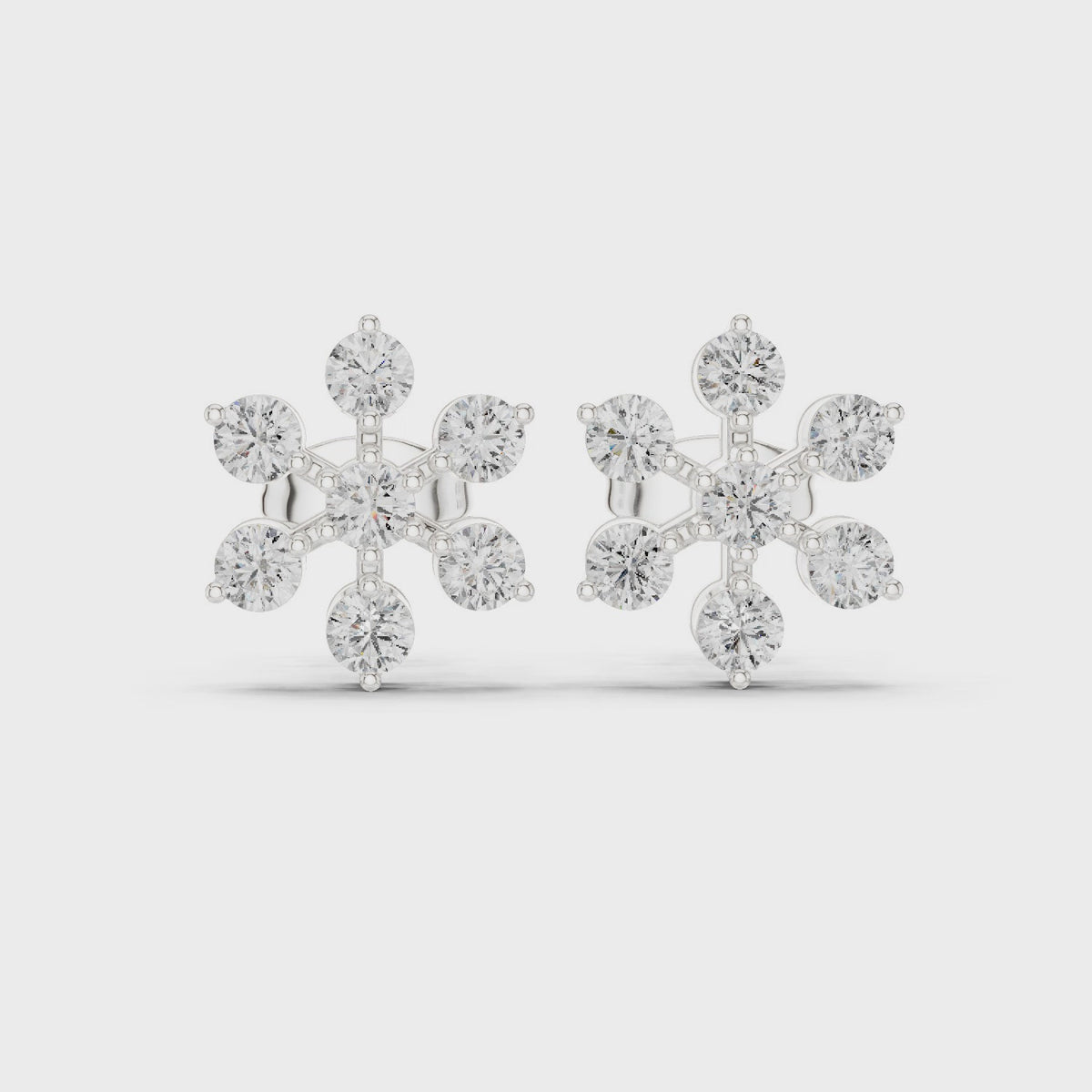 Round lab-grown diamond flower cluster stud earrings in white gold, 360 degree video