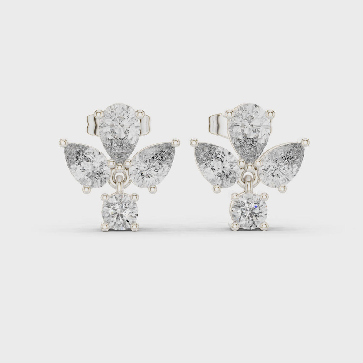 Pear and round lab-grown diamond petal cluster earrings in white gold, 360 degree video