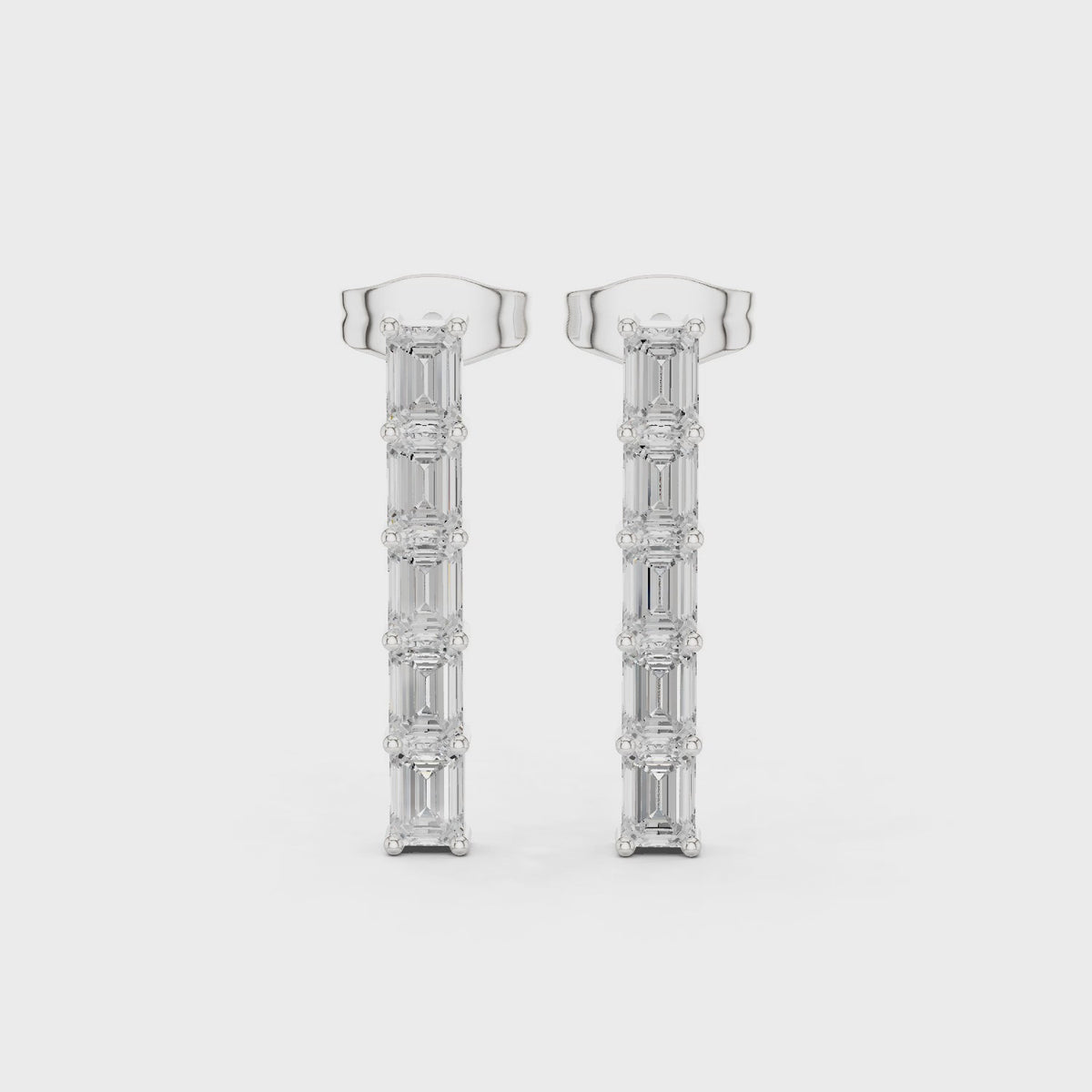 Emerald-cut lab-grown diamond line drop earrings in white gold, 360 degree video