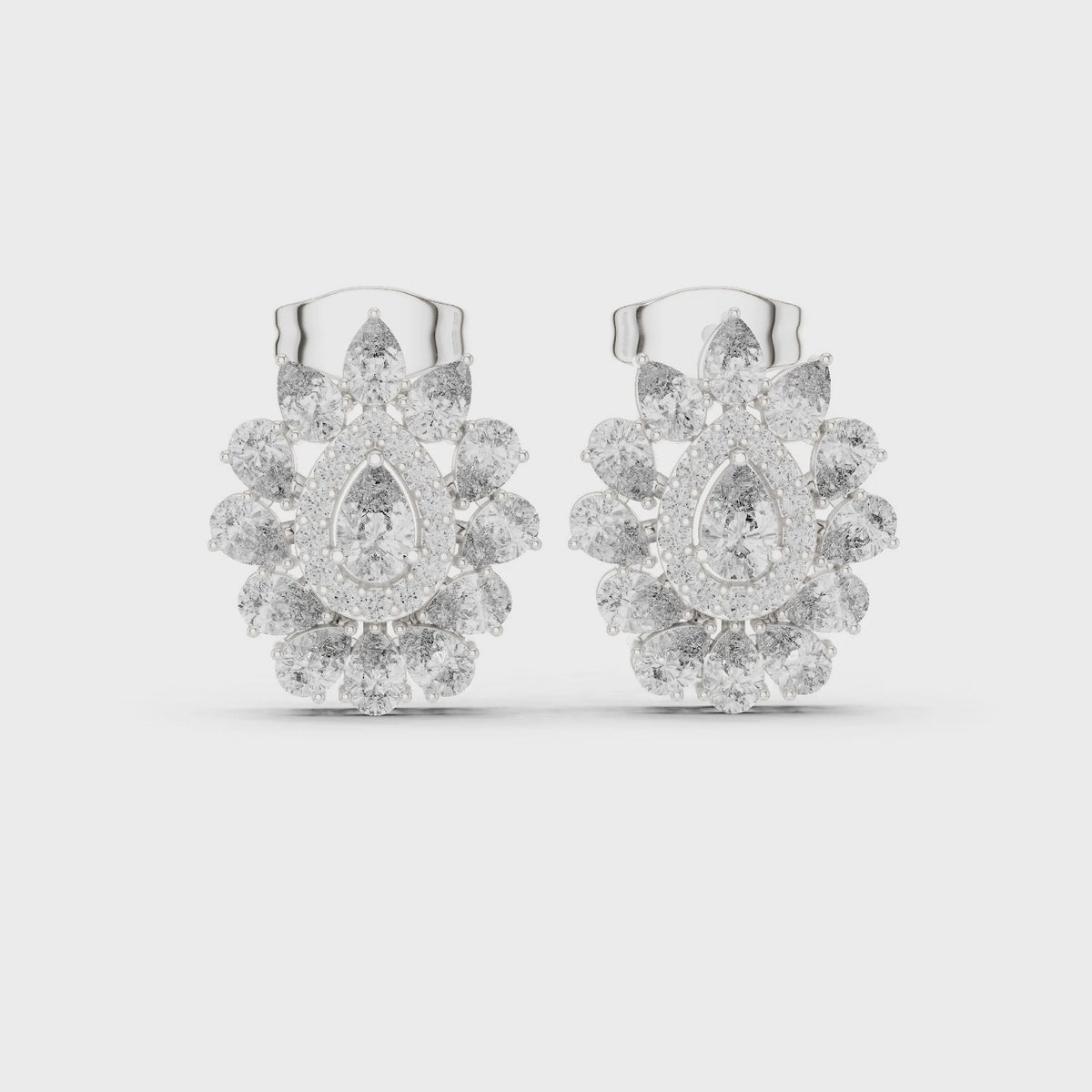 Pear and round lab-grown diamond halo cluster stud earrings in white gold, 360 degree video