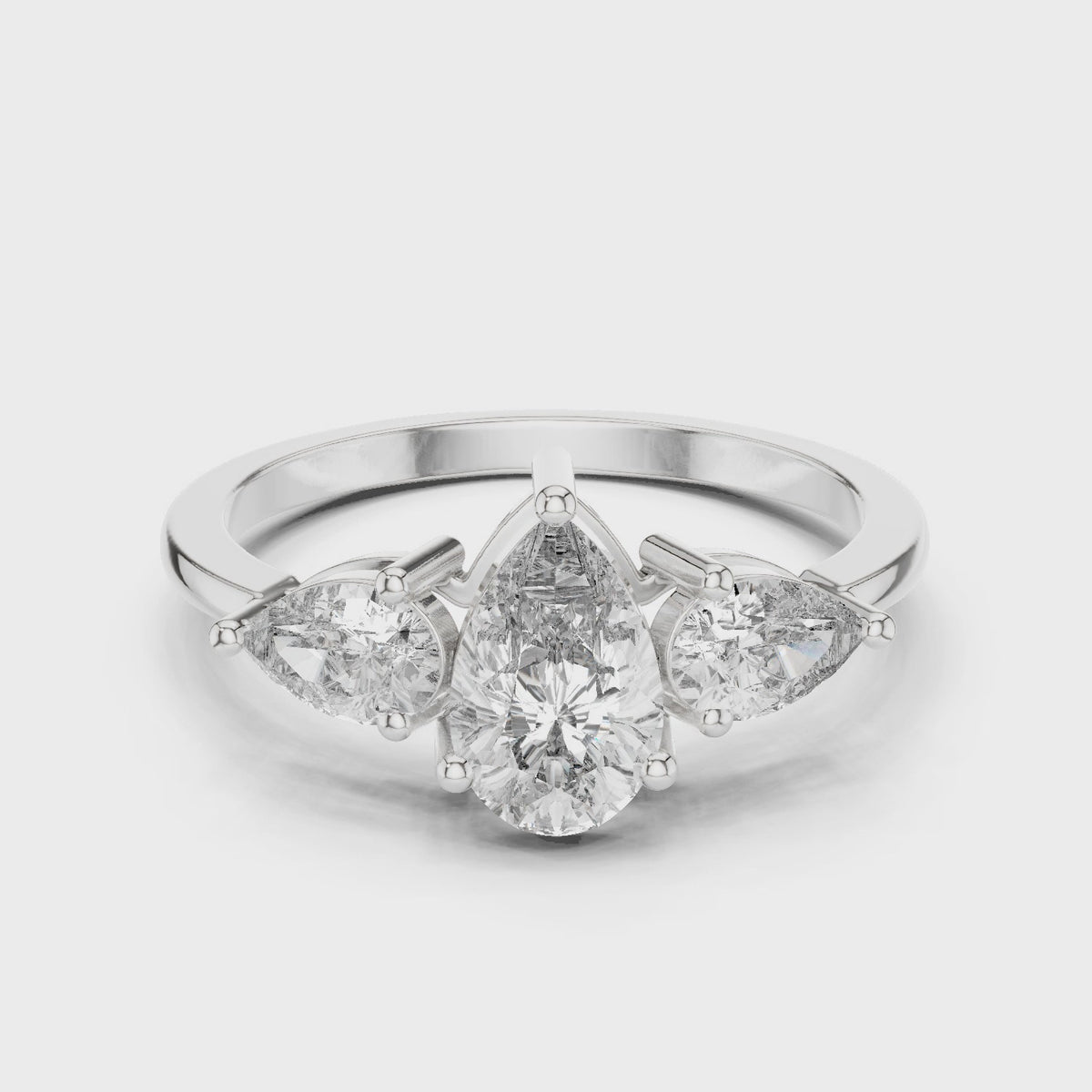 Pear lab-grown diamond three stone engagement ring in white gold, 360 degree video