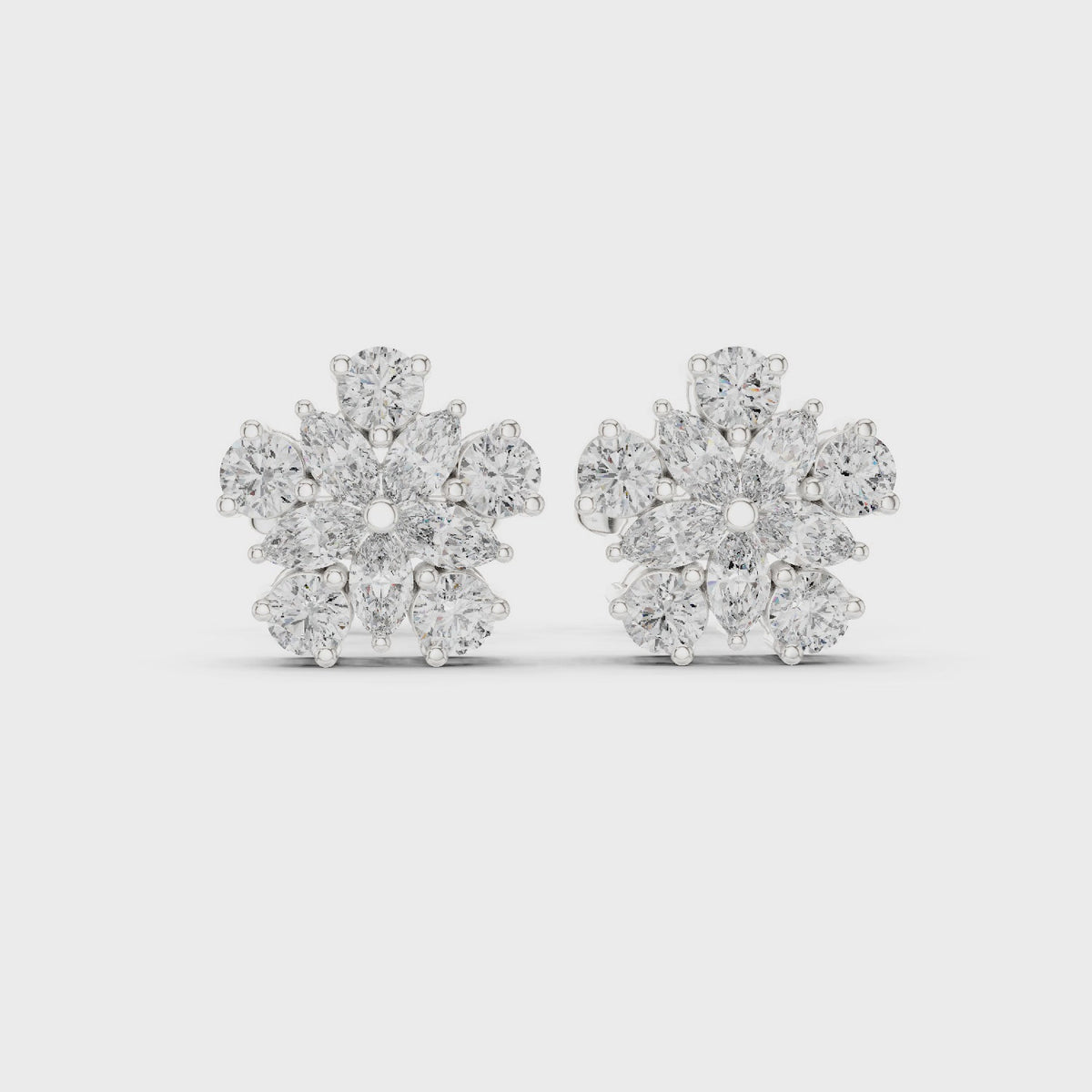 Round and marquise lab-grown diamond flower cluster stud earrings in white gold, 360 degree video