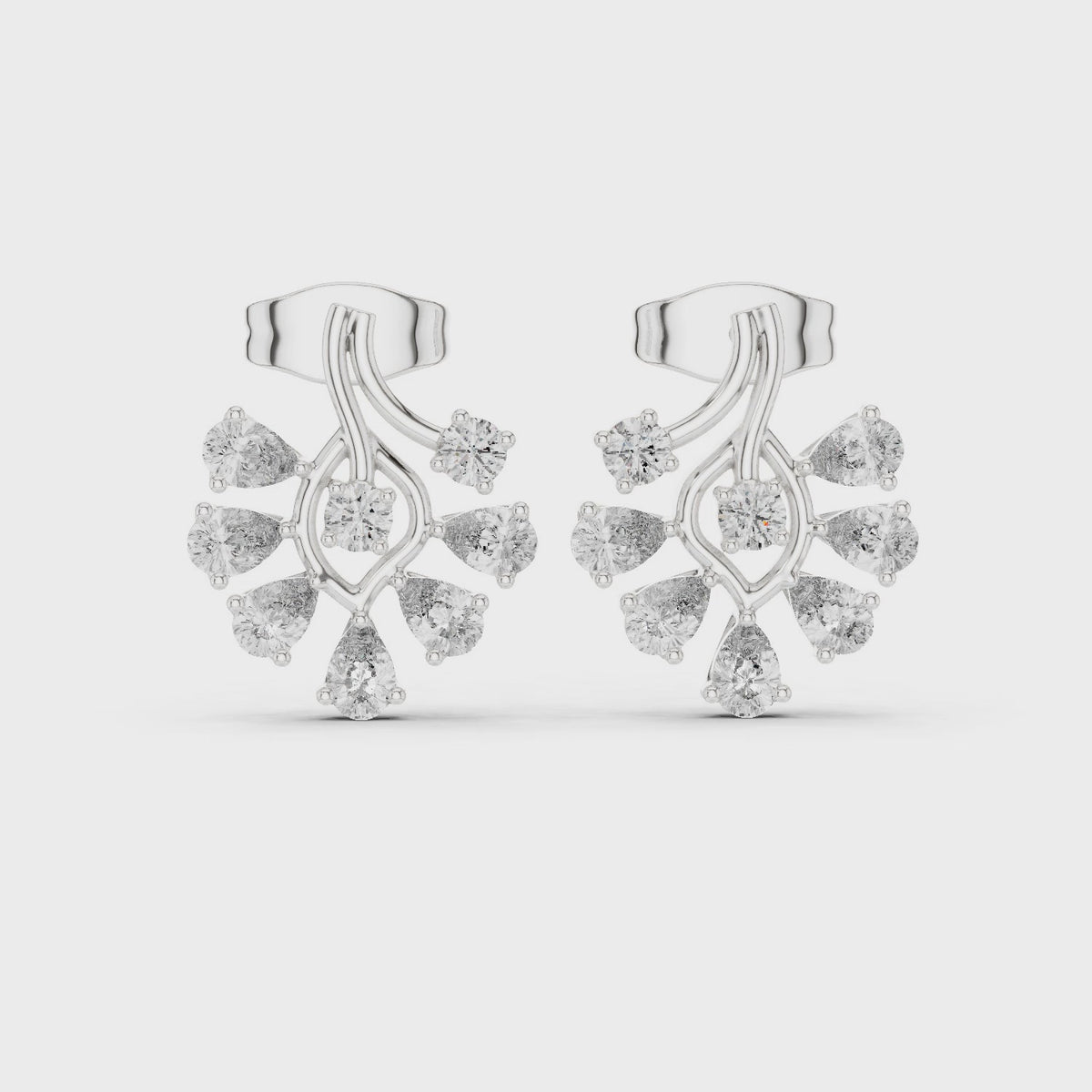 Pear and round lab-grown diamond flower cluster stud earrings in white gold, 360 degree video
