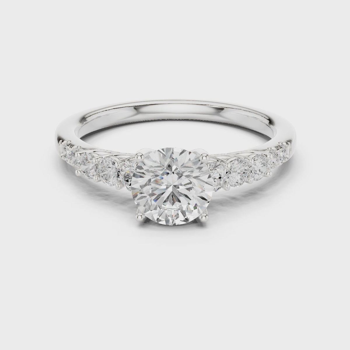 Round lab-grown diamond engagement ring with side stones in white gold, 360 degree video