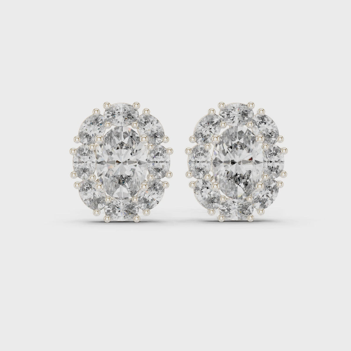 Oval lab-grown diamond halo stud earrings in white gold, 360 degree video
