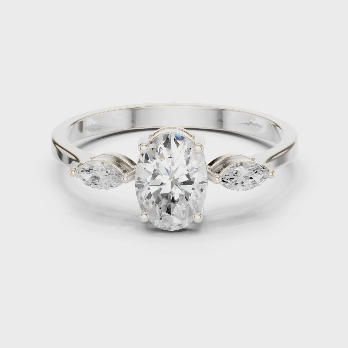 Oval lab-grown diamond three-stone engagement ring with marquise side stones in white gold, 360 degree video