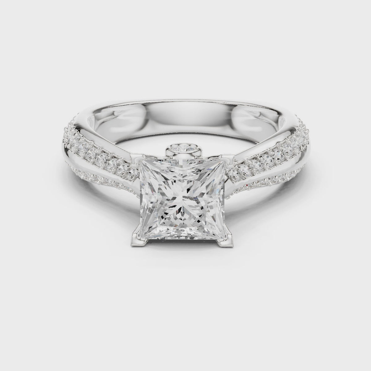 Princess-cut lab-grown diamond cathedral engagement ring with side stones in white gold, 360 degree video